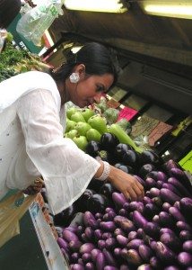 checking vegetables in an Indian grocery in Jackson Heights, 74th Street. Photo: Lavina Melwani 