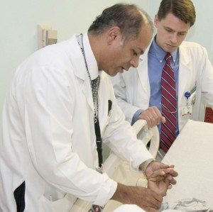 Dr. Abraham Verghese, author of 'Cutting for Stone', with a patient