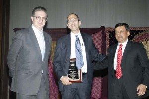 Consul General Prabhu Dayal presents the Making a Difference Award to Mark Templer of Hope Worldwide. The award was sponsored by HSBC Private Bank, represented by Michael Mount.