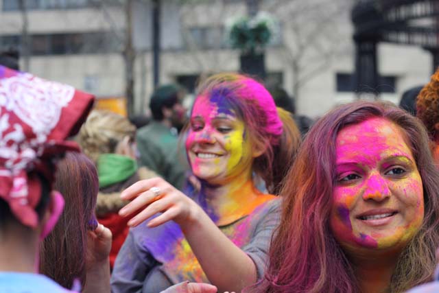 Girls with colored faces at Holi Hai celebrations 