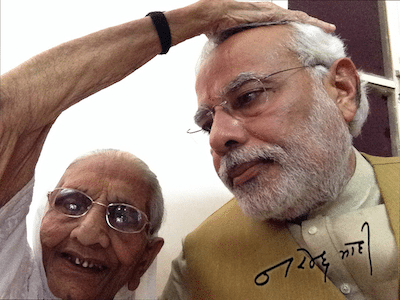 Narendra Modi getting blessings from his  mother