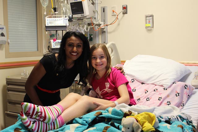 Nina Davuluri with a young patient