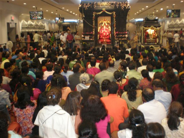 Devotees worshipping at the Hindu temple