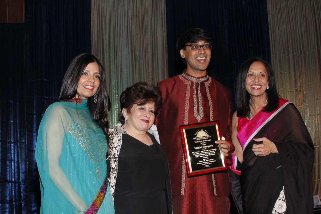 . Honoree Manjul Bhargava with emcee Tinku Jain, CHI co-founder Lavina Melwani and CHI president Maya Rajani