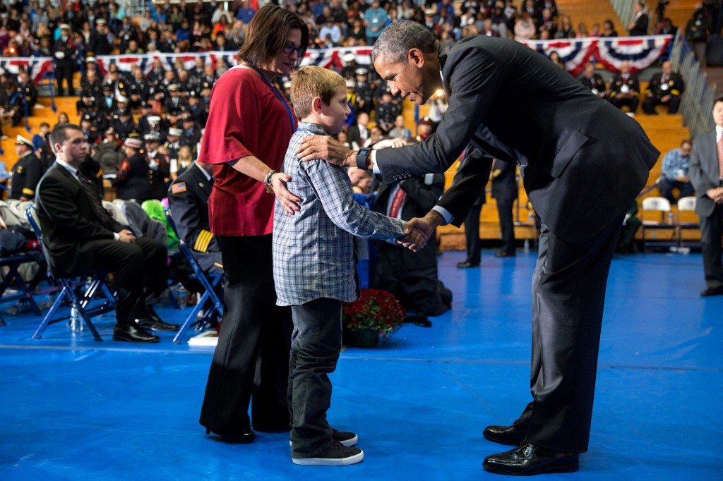 “The President greets families of firefighters during the reading of names at the National Fallen Firefighters Memorial Service at Mount Saint Mary’s University in Emmitsburg, Md.” (Official White House Photo by Pete Souza)