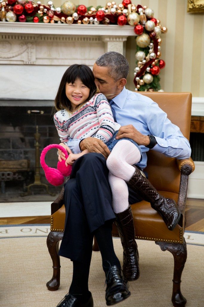 “The President snuggles with his niece Savita Ng after his sister, Maya Soetoro-Ng, and her family dropped by the Oval Office.” (Official White House Photo by Pete Souza)