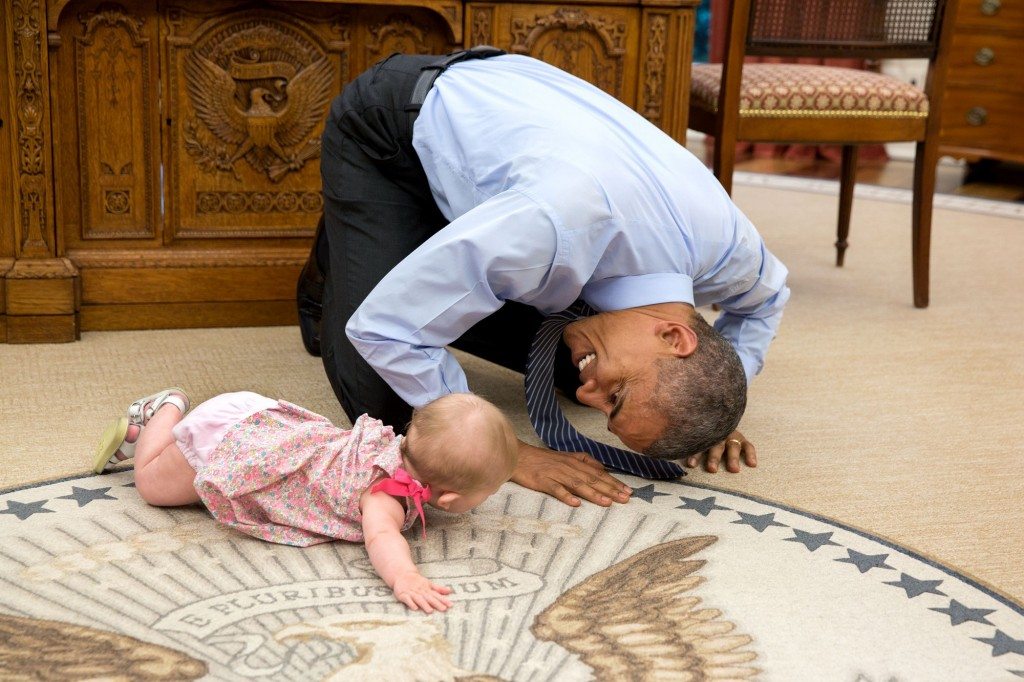 “At the President’s insistence, Deputy National Security Advisor Ben Rhodes brought his daughter Ella by for a visit. As she was crawling around the Oval Office, the President got down on his hands and knees to look her in the eye.” (Official White House Photo by Pete Souza)