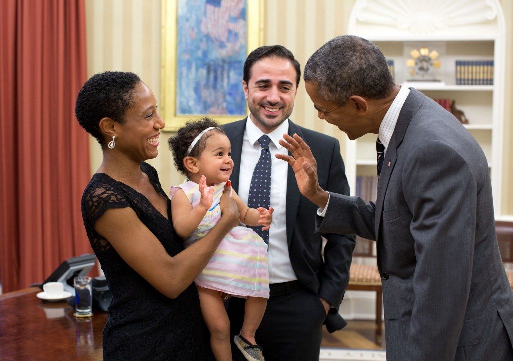 “The President exchanges a wave with Alya Dorelien Bitar, one-year-old daughter of Maher Bitar, the outgoing National Security Council Director for Israeli and Palestinian Affairs, and his wife, Astrid Dorelien, during a family photo in the Oval Office.” (Official White House Photo by Pete Souza)