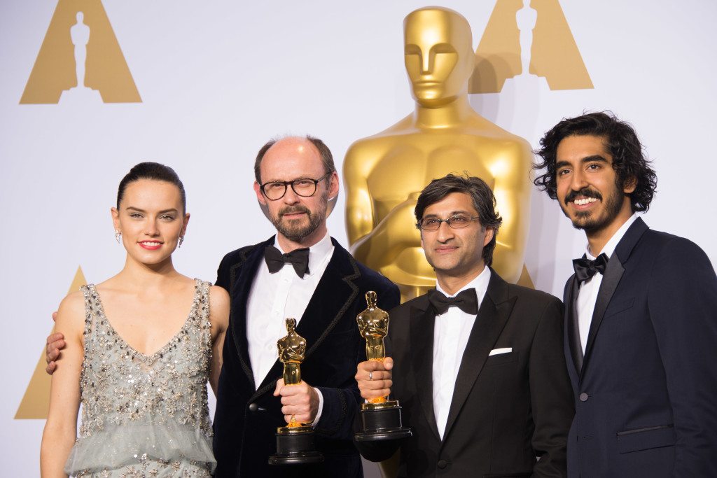 James Gay-Reese and Asif Kapadia pose backstage with the Oscar® for Best Documentary Feature, for work on “Amy”, with Daisy Ridley and Dev Patel during the live ABC Telecast of The 88th Oscars® at the Dolby® Theatre in Hollywood, CA on Sunday, February 28, 2016.