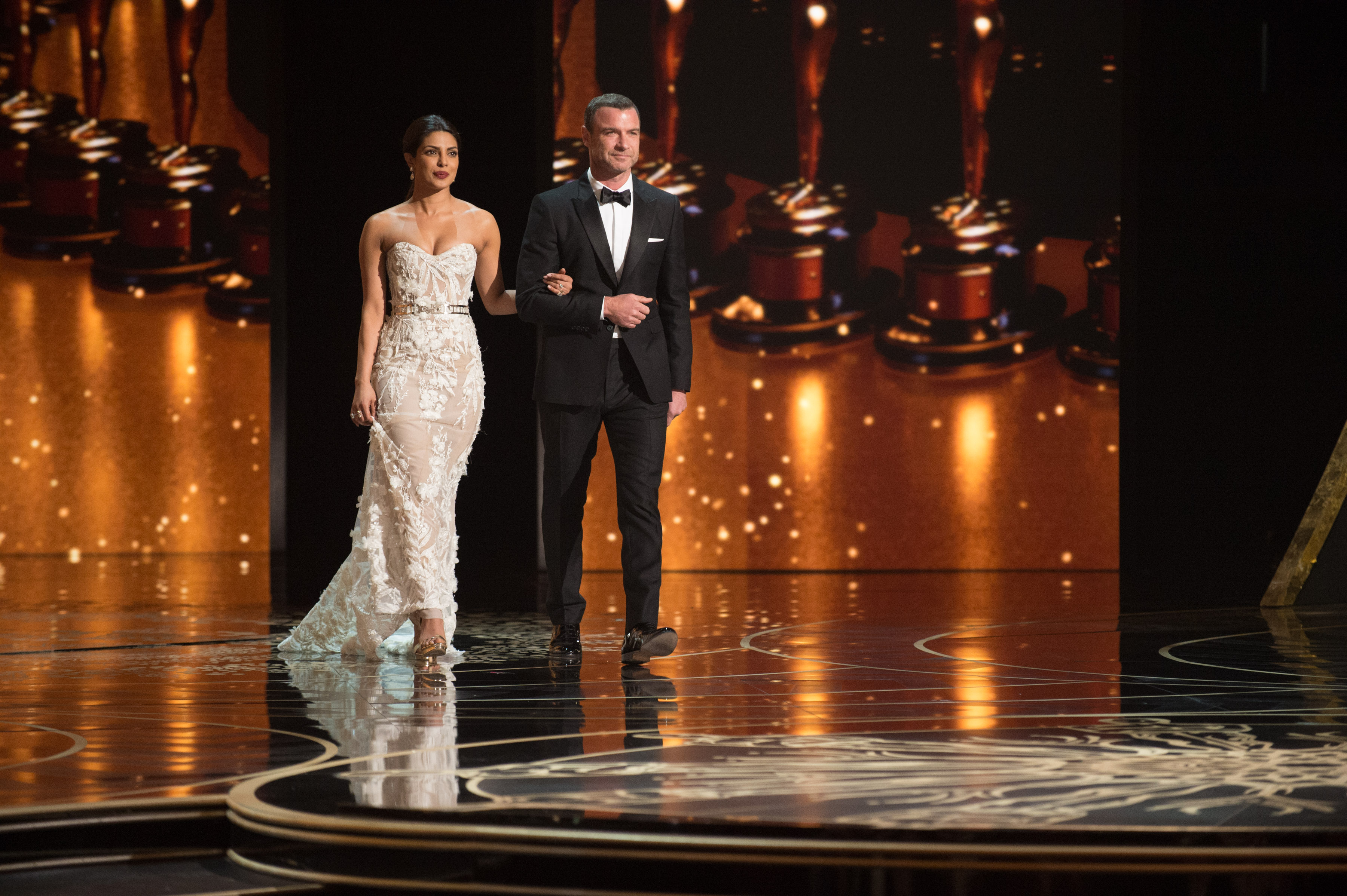 Presenters Priyanka Chopra and Liev Schreiber on stage during the live ABC Telecast of The 88th Oscars® at the Dolby® Theatre in Hollywood, CA on Sunday, February 28, 2016.