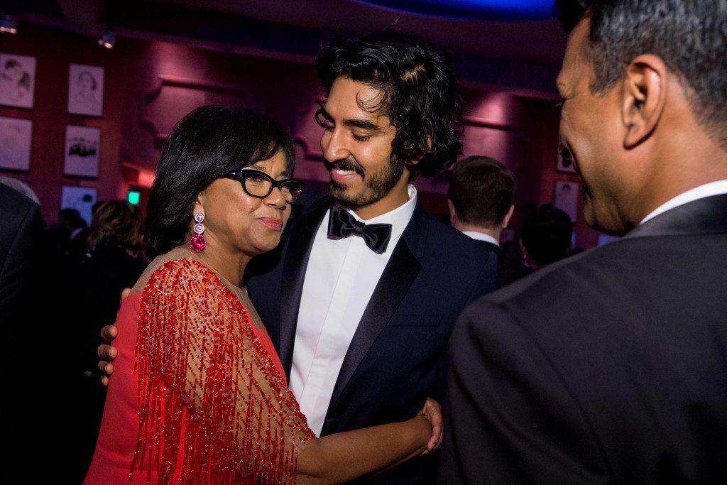 Academy President Cheryl Boone Isaacs and Dev Patel at the Governors Ball with the Oscar® for Achievement in directing, for work on “The Revenant” during the live ABC Telecast of The 88th Oscars® at the Dolby® Theatre