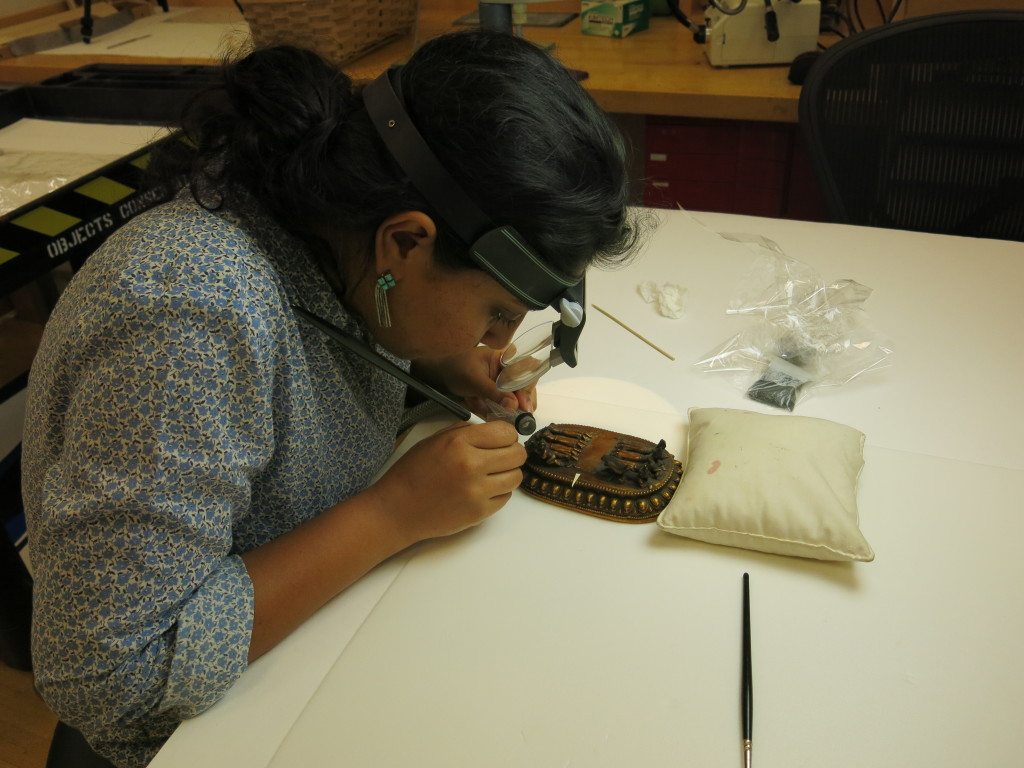 2.Mandira Chhabra—formerly ChhatrapatiShivajiMaharajVastuSangrahalaya (CSMVS) and Himalayan Society for Heritage and Art Conservation, Mumbai, currently graduate student at the Courtauld Institute, London—while examining the base of a gilded and painted stucco figure of Vajrabhairava from Mongolia. During her tenure at the Metropolitan Museum, Ms Chhabra focused on decorated surfaces, incorporating both high and low tech investigative methods for examining, documenting, and treating Asian works of art.