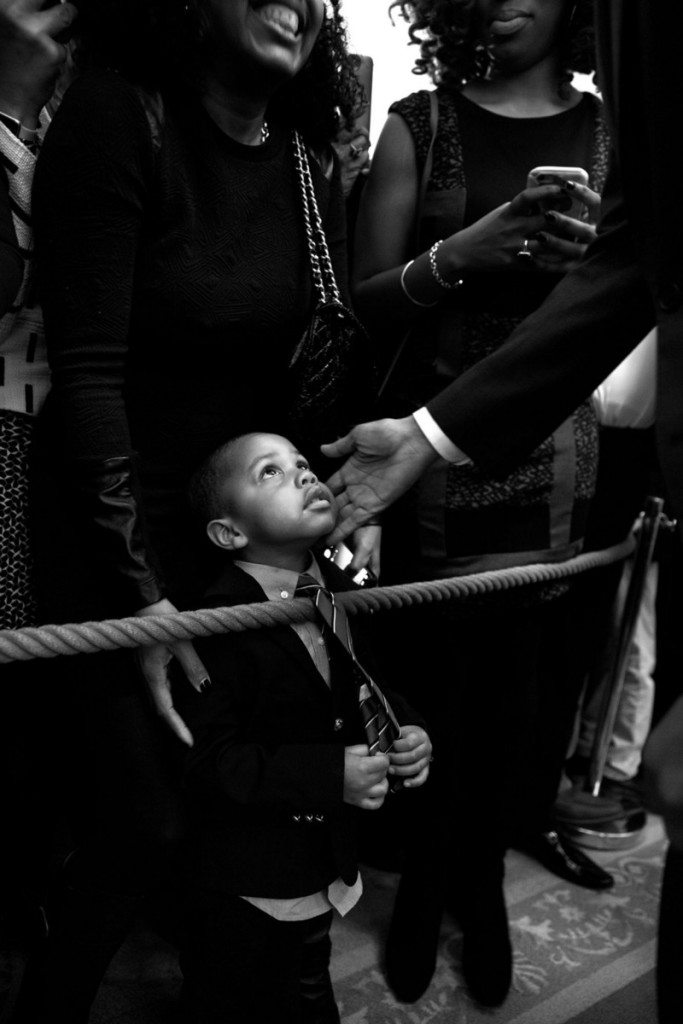 1. “I had my eye on this youngster while President Barack Obama spoke during a reception at the White House celebrating African American History Month. When the President starting greeting audience members along the rope line, I bent down in front of the young man and captured this moment of the President touching his face before he too bent down to greet him. Afterwards, I tracked down his name — Clark Reynolds — and had the President sign a copy for him.” (Official White House Photo by Pete Souza)