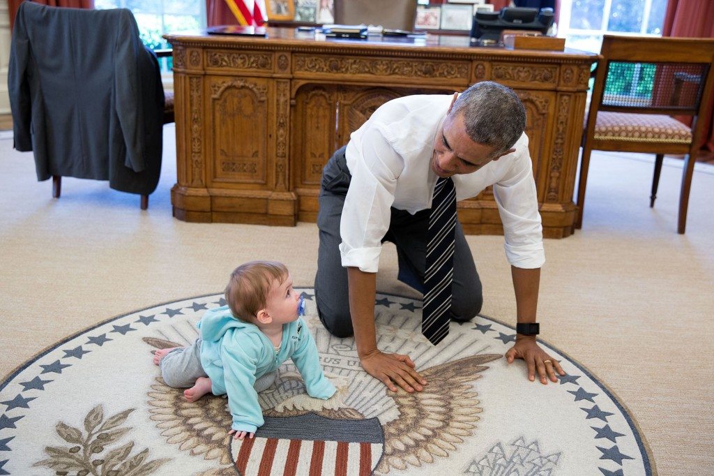 6. April 14, 2016 “The President is always asking staff to bring their babies and young kids by for a visit. Here, during a break between meetings one afternoon, the President crawled around in the Oval Office with Communications Director Jen Psaki’s daughter Vivi.” (Official White House Photo by Pete Souza)