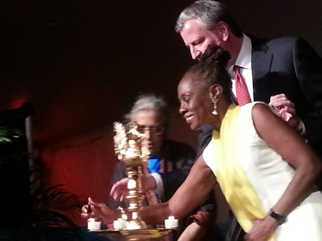 Mayor Bill de Blasio, First Lady Chirlaine McCray and Dr. Uma Mysorekar light the Diwali lamp