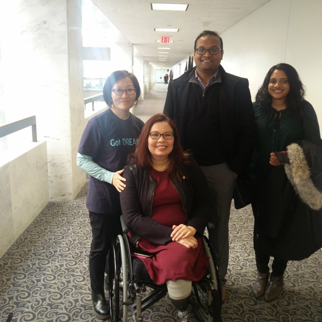 Chirayu Patel with with Senator Tammy Duckworth from IL in wheelchair along with Lakshmi Sridaran of SAALT and Inhe Choi (Executive Director of NAKASEC - Korean American Organization).