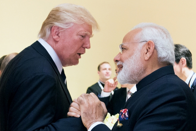 President Donald Trump greets PM Narendra Modi