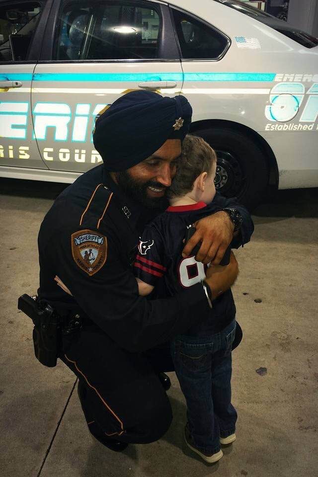 Dep. Sandeep Dhaliwal with a member of the community