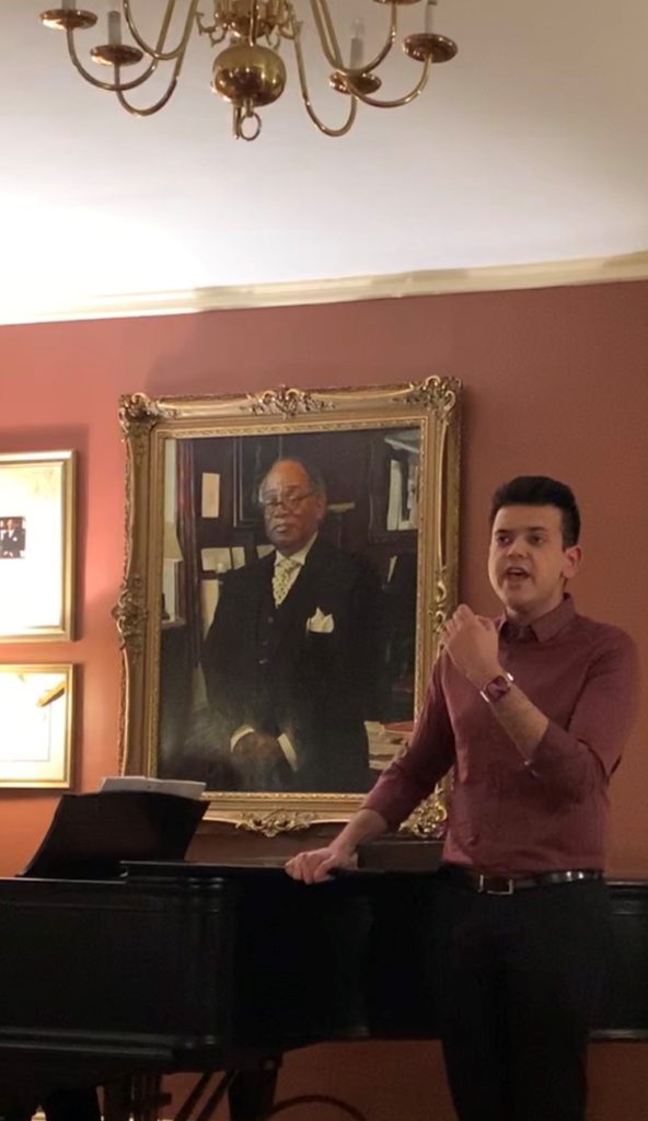 Arhan Kumar singing at a recital at Harvard