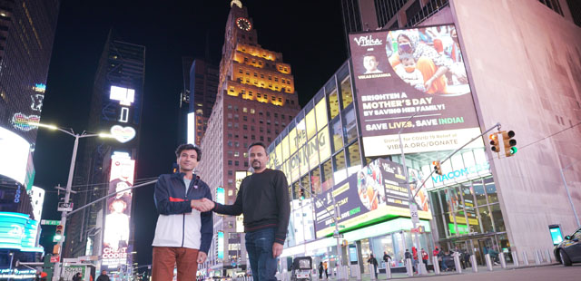 Vikas Khanna and Keyur Shah of Vibha promoting Covid relief for India in Times Square