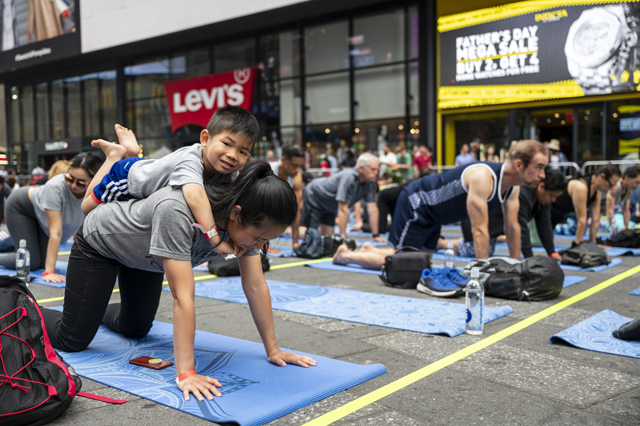 Yoga - smallest yogi at Summer Solstice in Times Square