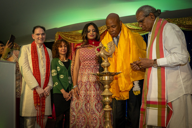 Mayor Adams with Dilip Chauhan, Meera Joshi, Jenifer Rajkumar and the priest