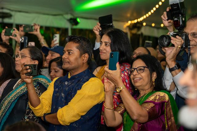 Guests recording the Diwali event at Gracie Mansion