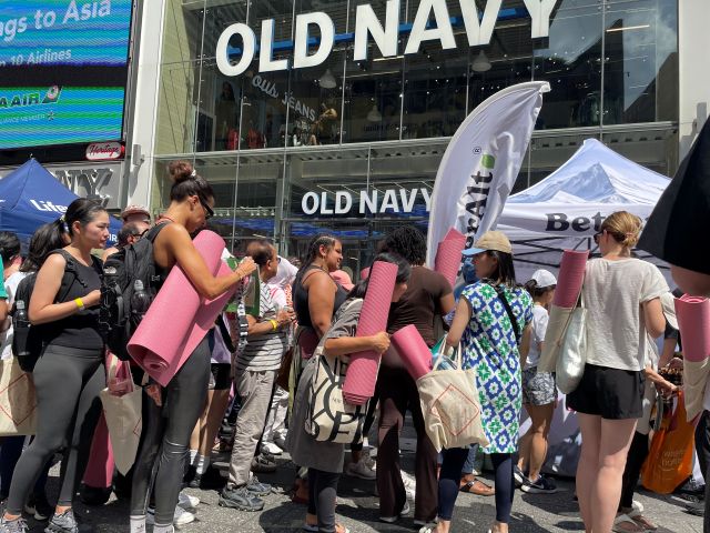 A sea of pink yoga mats in Times Square