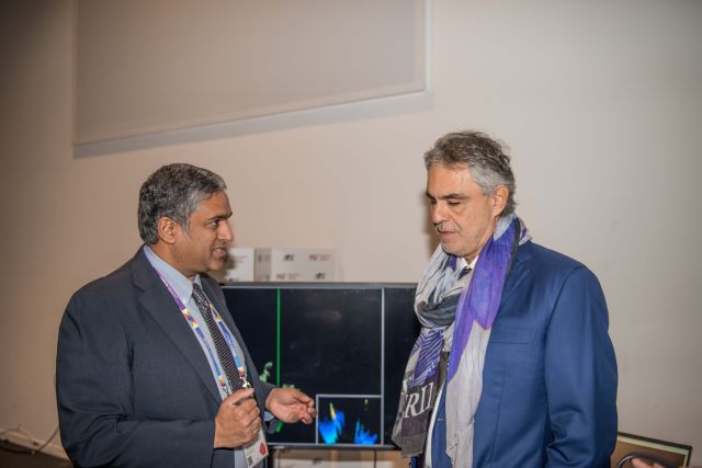 Provost Chandrakasan demonstrating technology designed for the visually impaired to Andrea Bocelli in Milan in 2015