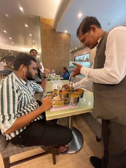 A diner eating the endless vegetarian thali at Shiv Sagar