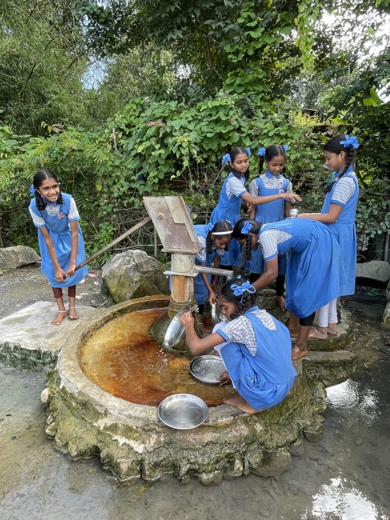 Vegetarian food article Government school girls cleaning their thalis after lunch