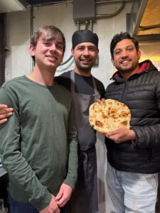 The chefs of Hyderabadi Zaiqa show how to make a naan to foodie Tyler Melwani