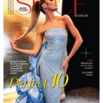 Fashion magazine cover featuring a model in a glittering strapless blue gown posed against a gold and black backdrop, with bold red word 'STYLE' and 'FASHION SPECIAL' in the top-right corner.