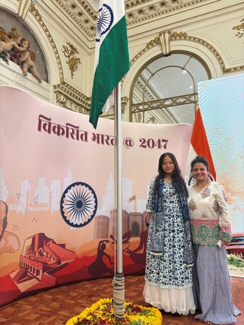 Mother and Daughter take a selfie with the tricolor flag