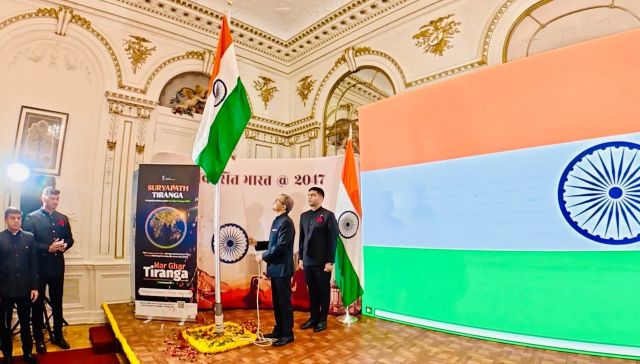 Raisinng the tricolor flag